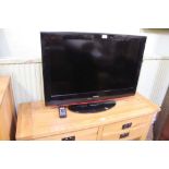 A MEDION BRANDED FLAT SCREEN TV with remote control