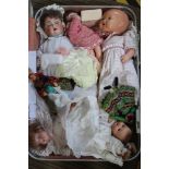 A SUITCASE CONTAINING COLLECTORS DOLLS various