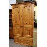 A MODERN PINE TWO DOOR WARDROBE with 2 full width drawers below