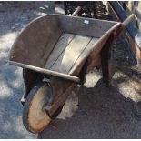 A WOODEN WHEELBARROW