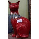 A ROUGE GLAZED POOLE POTTERY SEATED CAT