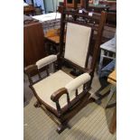 A WOODEN FRAMED 19TH CENTURY AMERICAN STYLE ROCKING ARMCHAIR with mushroom velour upholstered back