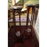 A PAIR OF MODERN MAHOGANY FINISHED CIRCULAR TOPPED STANDS on barley twist supports