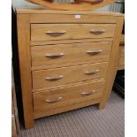 A MODERN OAK FINISHED FREESTANDING GRADUATING FOUR DRAWER CHEST