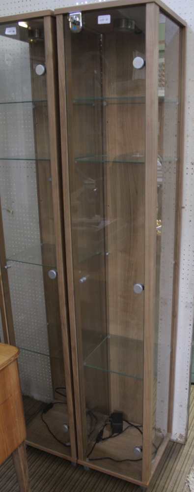 A MODERN FREESTANDING THREE QUARTER GLAZED DISPLAY UNIT, front door opening to reveal adjustable