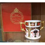 A ROYAL CROWN DERBY ENGLISH IMARI PAINTED TWIN HANDLED LOVING CUP in presentation box