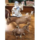 A COLLECTION OF POTTERY MODEL DONKEYS to include two boxed Beswick examples