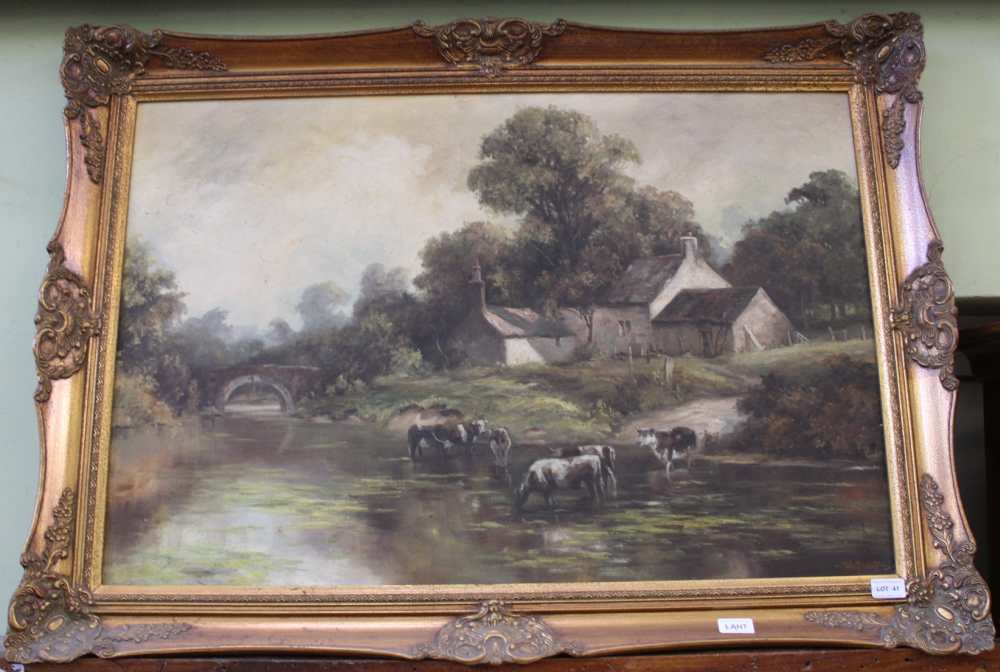 JOHN TRICKETT A large oil on canvas study of cattle watering in a stream with Cottage behind,