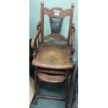 AN EARLY 20TH CENTURY OAK METAMORPHIC CHILD'S HIGHCHAIR