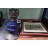 A BLUE GLASS & METAL OIL LAMP together with a carved wooden tray and a small selection of prints