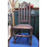 AN 18TH CENTURY SINGLE CHAIR, having plain slat back over solid seat, turned and block fore legs