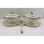 A PAIR OF WEDGWOOD CREAMWARE SAUCE TUREENS, with integral bases, the covers with sepia painted petal