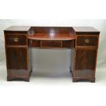 A 19TH CENTURY MAHOGANY SIDEBOARD, twin pedestal design with bow front drawer section, crossbanded