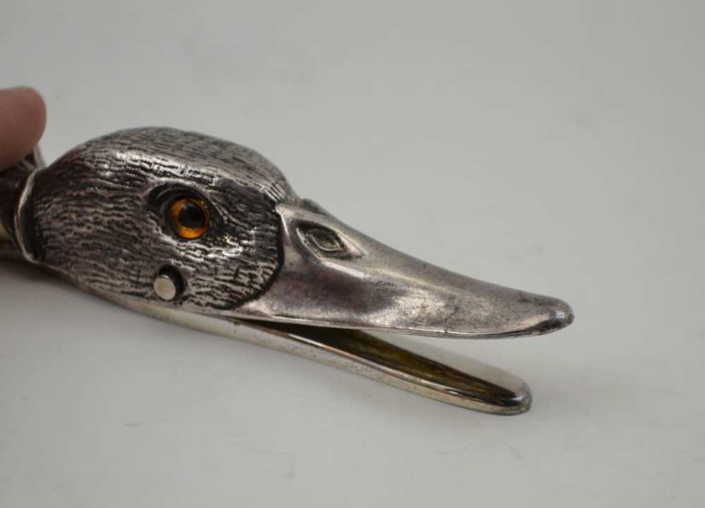 A PLATED CLIP IN THE FORM OF A DUCK'S HEAD, inset glass eyes, 12.5cm - Image 2 of 3