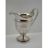 JOHN SCHOFIELD A GEORGE III SILVER MILK JUG, helmet form, cast leaf decoration to handle and