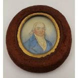 A 19TH CENTURY MINIATURE PORTRAIT PAINTING, gentleman in a blue coat, his cravat pinned with a heart