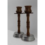 A PAIR OF EARLY TO MID 20TH CENTURY CANDLESTICKS aluminium bases with horn effect stems and sconces,