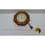 A 19TH CENTURY BLACK FOREST STYLE POSTMAN'S WALL CLOCK the octagonal case with marquetry inlay,