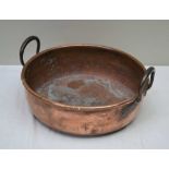 A 19th CENTURY COPPER PRESERVING PAN with two loop handles