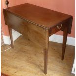 A 19TH CENTURY MAHOGANY PEMBROKE TABLE fitted end drawer with brass drop handle, on tapering