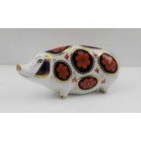 A ROYAL CROWN DERBY PIG PAPERWEIGHT, decorated in the Imari palette (with gold coloured button) 12.