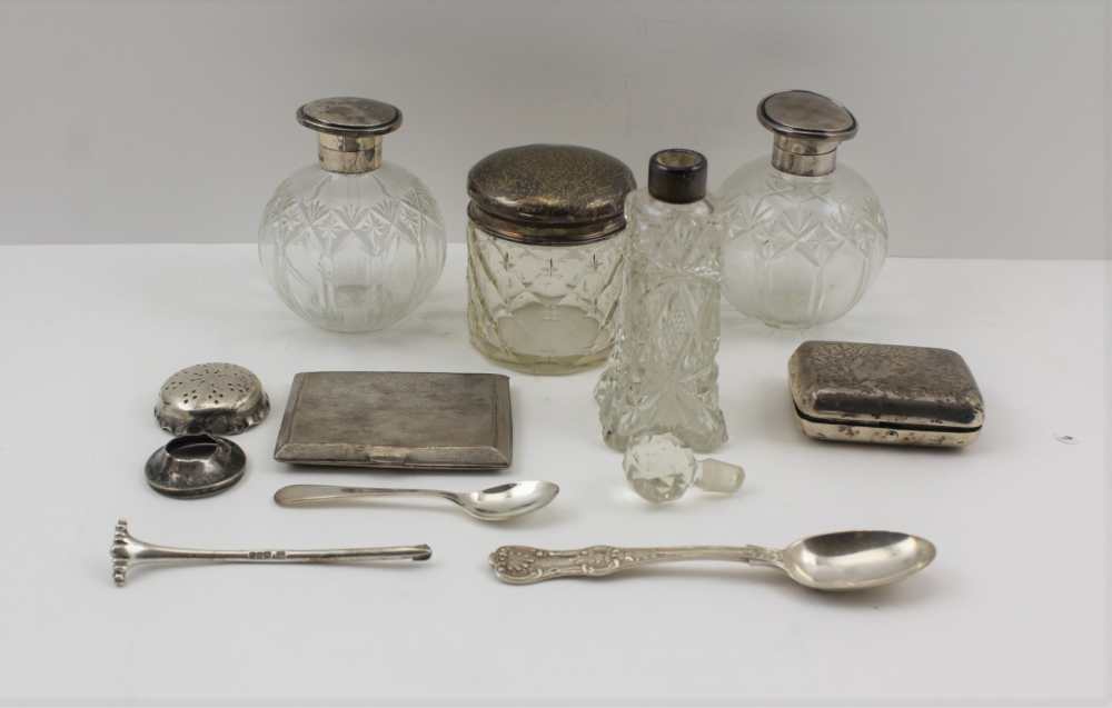 A PAIR OF CUT GLASS GRENADE FORM SCENT BOTTLES, with silver tops, Birmingham 1928, together with a