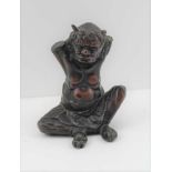 A JAPANESE MEIJI PERIOD CAST LEAD SEATED DEMON or DEVIL bronzed patinated, 12cm high