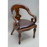 A LATE VICTORIAN MAHOGANY TUB SHAPED SCROLL ARM ELBOW CHAIR, on turned legs to the front
