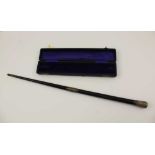 AN EARLY 20TH CENTURY CONDUCTOR'S BATON in silver mounted ebony, with presentation inscription,
