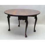 A MID-18TH CENTURY MAHOGANY OVAL DROPLEAF SUPPER TABLE fitted one end drawer, raised on cabriole
