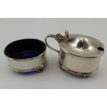 ADIE BROTHERS A GEORGIAN DESIGN LIDDED SILVER MUSTARD POT AND MATCHING SALT, of plain oval form,