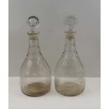 A PAIR OF GEORGE III CLEAR GLASS MALLET FORM DECANTERS, facet cut with vestica stoppers