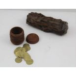 A CARVED COQUILLA NUT BOX, floral swag decoration, screw on lid, 4cm high, containing a quantity