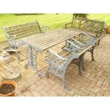 A CAST IRON FRAMED GARDEN TABLE with teak slatted top, together with a two-seater BENCH and TWO