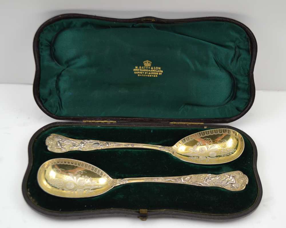 HENRY JOHN LIAS SENIOR & JUNIOR A PAIR OF PARCEL-GILT STERLING SILVER FRUIT SPOONS, cast