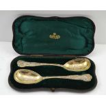 HENRY JOHN LIAS SENIOR & JUNIOR A PAIR OF PARCEL-GILT STERLING SILVER FRUIT SPOONS, cast