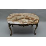 A 20TH CENTURY CONTINENTAL OCCASIONAL TABLE, figured, polished stone serpentine top upon a gilded