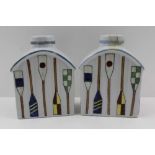 A PAIR OF 20TH CENTURY CONTINENTAL VESSELS OF TEAPOY FORM, hand enamelled with polychrome oars, 12cm