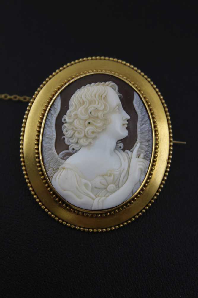 A VICTORIAN CARVED SHELL CAMEO BROOCH, angel profile, mounted in a yellow metal oval brooch frame,