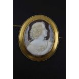 A VICTORIAN CARVED SHELL CAMEO BROOCH, angel profile, mounted in a yellow metal oval brooch frame,