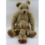 AN EARLY WORN BLONDE PLUSH TEDDY BEAR, with button eyes, 54cm and one other SMALL BEAR (2)