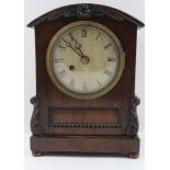 A 19TH CENTURY ROSEWOOD CASED MANTEL CLOCK, the arch top with floral design, the base with