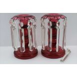 A PAIR OF LATE VICTORIAN CRANBERRY TABLE LUSTRES, 18cm high
