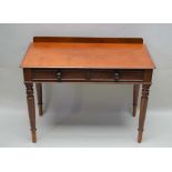 A LATE 19TH CENTURY MAHOGANY SIDE TABLE with plain upstand, having two inline drawers, supported