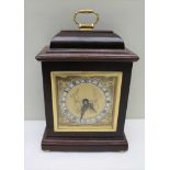 AN ELLIOT OF LONDON MANTEL CLOCK, polished case with brass handle to the top, square brass face with