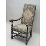 A 19TH CENTURY JACOBEAN DESIGN ARMCHAIR having faux stump work upholstered back and seat pad,