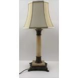 AN ALABASTER & GILT METAL DECORATIVE COLUMN FORM TABLE LAMP with cream shade