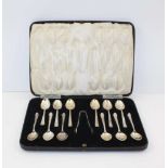 HENRY ATKIN A SET OF TWELVE SILVER TEASPOONS, Sheffield 1937 together with a pair of silver sugar