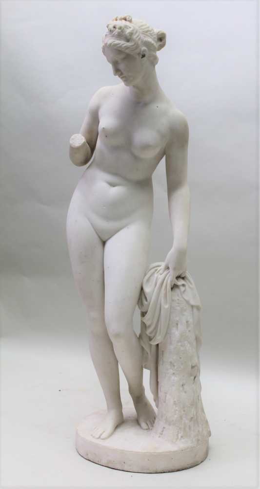A 19TH CENTURY MARBLE STATUE OF VENUS, after the antique, naked, standing beside a tree stump,