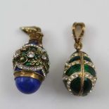 TWO FABERGE STYLE YELLOW METAL OVOID PENDANTS, enamel and stone set with suspension loops,